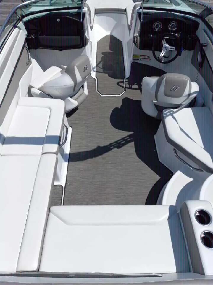 Slide: The Image of 2022 Four Winns HD2 boat interior with white seating and modern dashboard. - 12