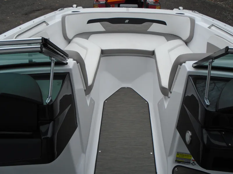 Slide: The Image of 2022 Four Winns HD2 boat interior with white and gray seating. - 14