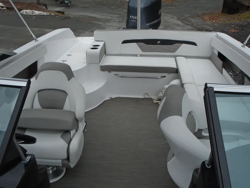 Slide: The Image of 2022 Four Winns HD2 boat interior with seating and steering wheel. - 15