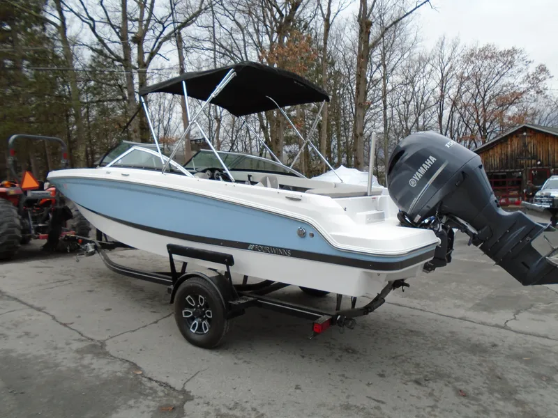 Slide: The Image of 2022 Four Winns HD2 boat with Yamaha outboard motor on trailer. - 3