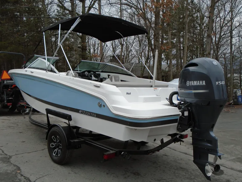 Slide: The Image of 2022 Four Winns HD2 boat with Yamaha 150 outboard motor on trailer. - 4