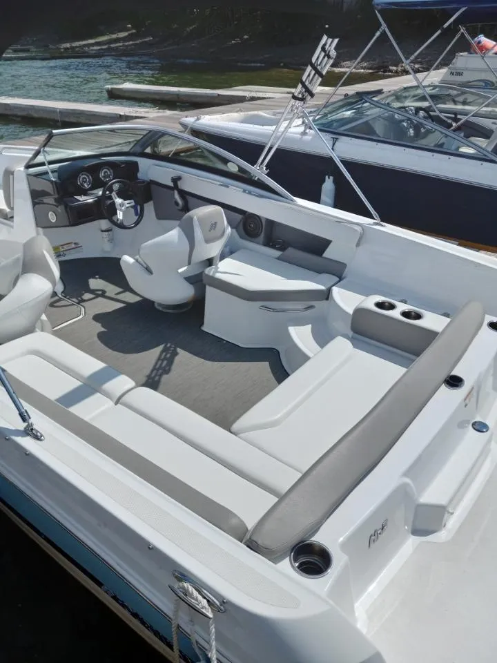 Slide: The Image of 2022 Four Winns HD2 boat interior with spacious seating and modern design. - 9