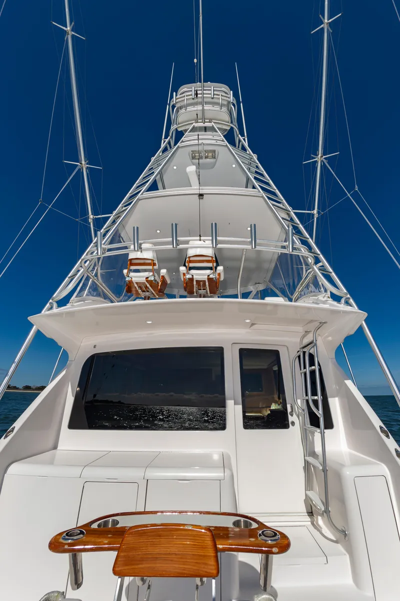 Slide: The Image of 2005 Viking Convertible yacht with tower against clear blue sky. - 12