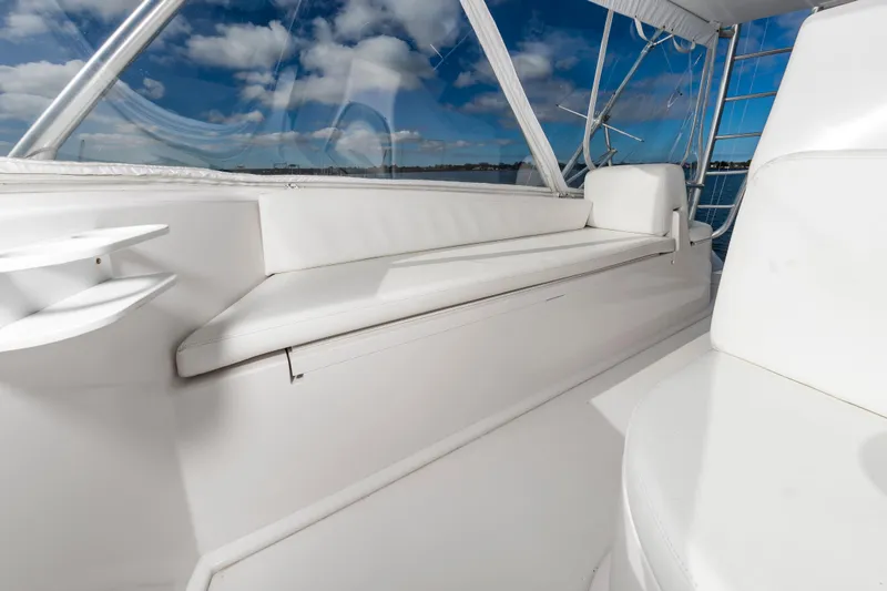 Slide: The Image of 2005 Viking Convertible yacht interior with white seating and ocean view. - 19