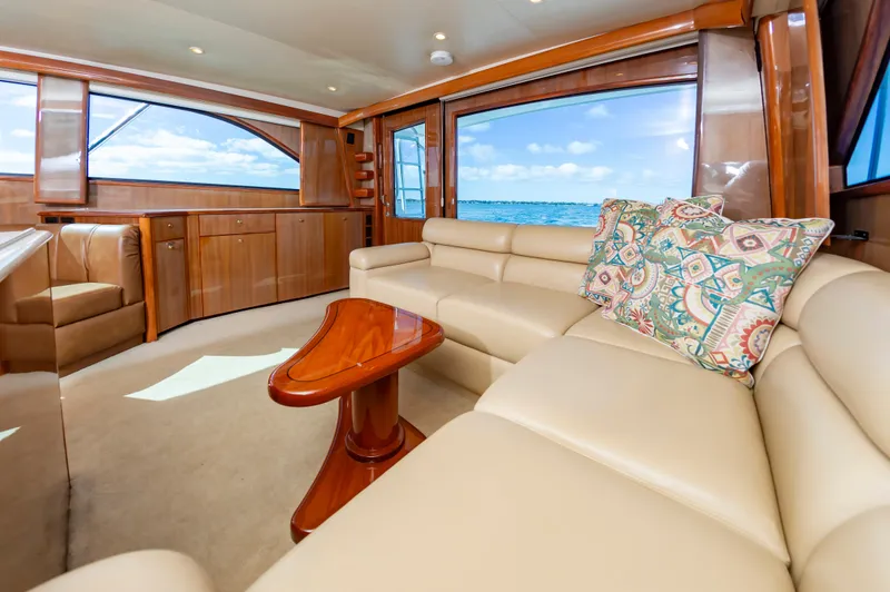 Slide: The Image of Luxurious interior of a 2005 Viking Convertible yacht with beige leather seating and ocean view. - 29