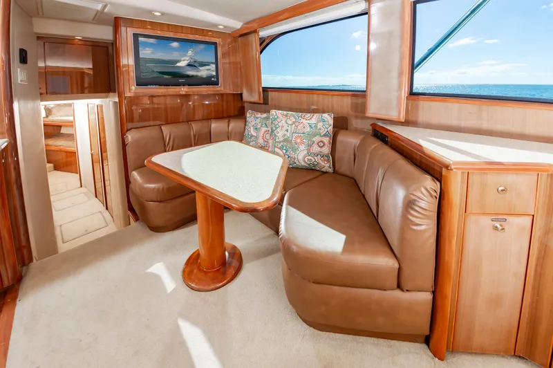 Slide: The Image of Luxurious interior of 2005 Viking Convertible yacht with leather seating and ocean view. - 33
