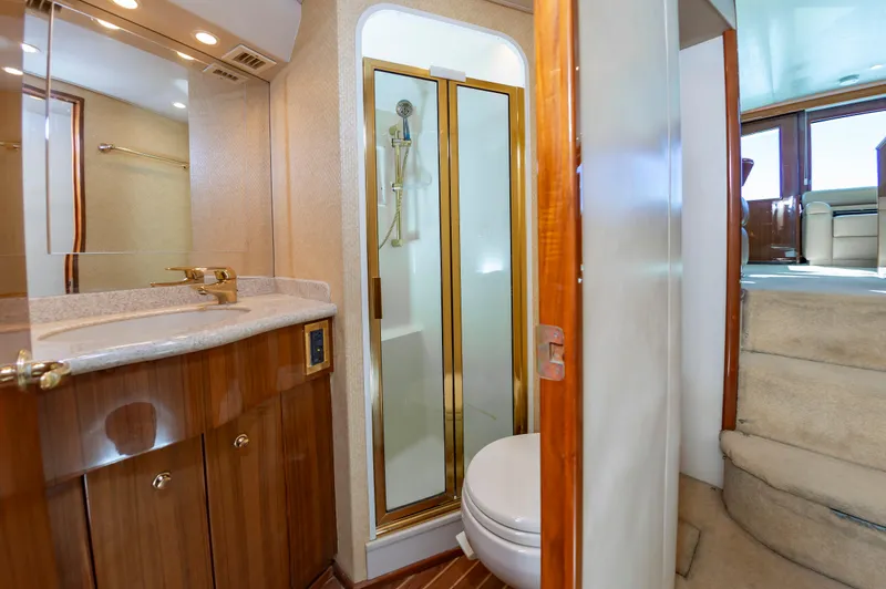 Slide: The Image of Luxurious bathroom in 2005 Viking Convertible yacht with shower and vanity. - 47