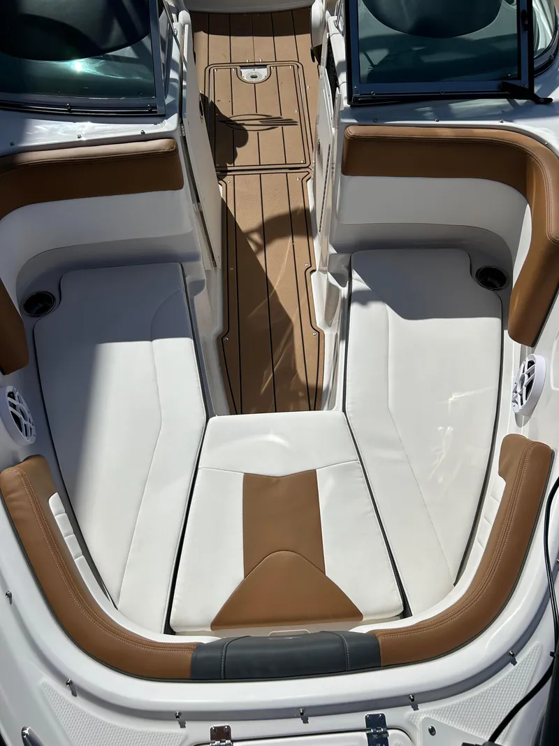 Slide: The Image of 2024 Chaparral 21 Ski & Fish boat interior with white and brown seating. - 11