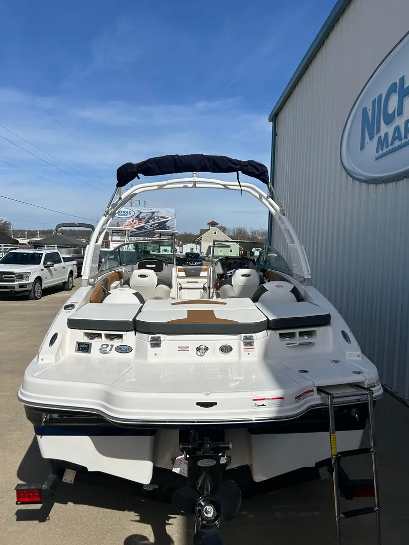 Slide: The Image of 2024 Chaparral 21 Ski & Fish boat at dealership, rear view. - 3