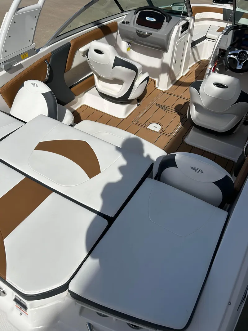 Slide: The Image of 2024 Chaparral 21 Ski & Fish boat interior with seating and dashboard. - 4