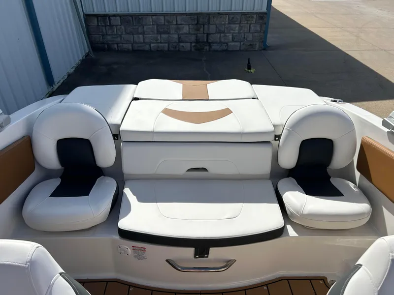 Slide: The Image of 2024 Chaparral 21 Ski & Fish boat interior with white cushioned seating. - 5