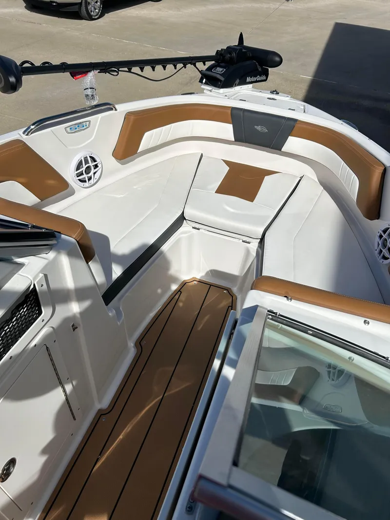 Slide: The Image of 2024 Chaparral 21 Ski & Fish boat interior with tan and white seating. - 8