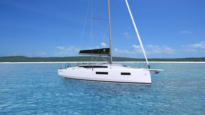 The Image of 2025 Jeanneau Sun Odyssey 350 sailboat on clear blue water under a sunny sky. - 1