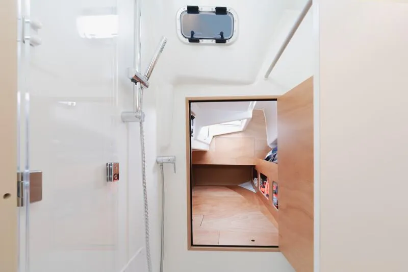 Slide: The Image of 2025 Jeanneau Sun Odyssey 350 interior with shower and cabin view. - 17