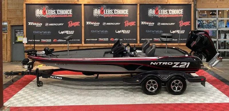 The Image of 2021 Nitro Z21 Pro bass boat on display with trailer. - 0