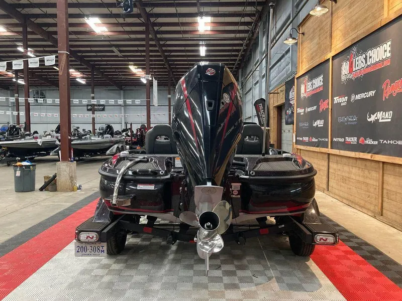 Slide: The Image of 2021 Nitro Z21 Pro bass boat displayed indoors, rear view. - 3