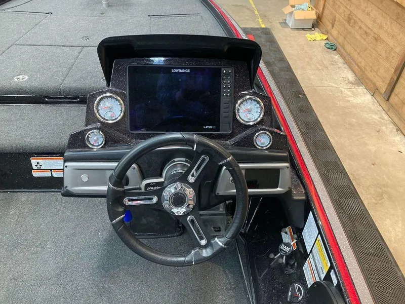 Slide: The Image of 2021 Nitro Z21 Pro boat dashboard with steering wheel and Lowrance display. - 6