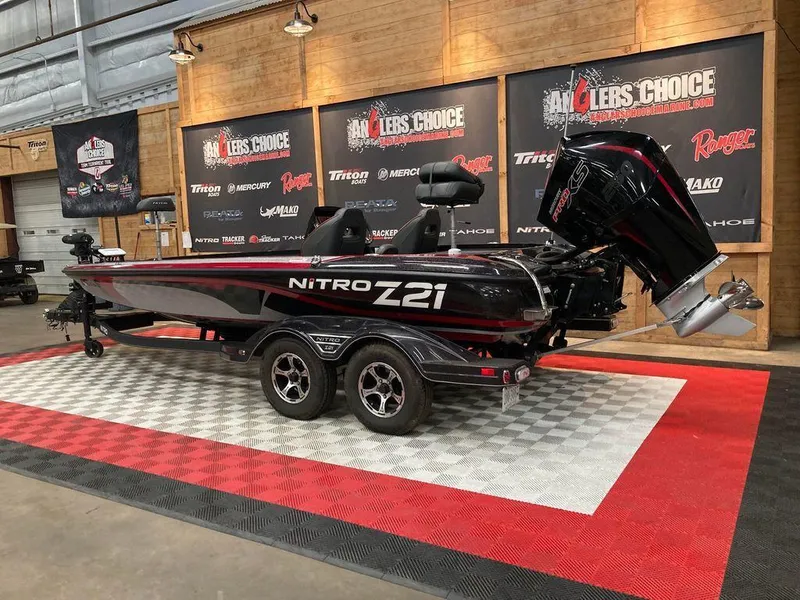 Slide: The Image of 2021 Nitro Z21 Pro bass boat on display at Angler's Choice event. - 8