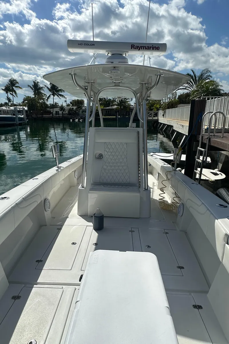 Slide: The Image of 1987 Whitewater 32 Open boat with Raymarine equipment docked in a marina. - 10