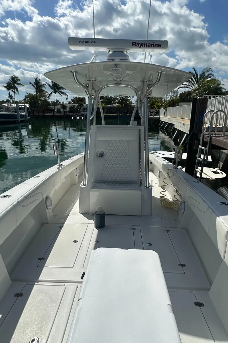 Slide: The Image of 1987 Whitewater 32 Open boat with Raymarine equipment docked at a marina. - 11