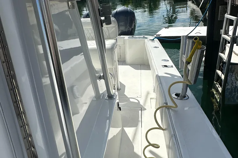 Slide: The Image of 1987 Whitewater 32 Open boat interior, docked with visible seating and equipment. - 13