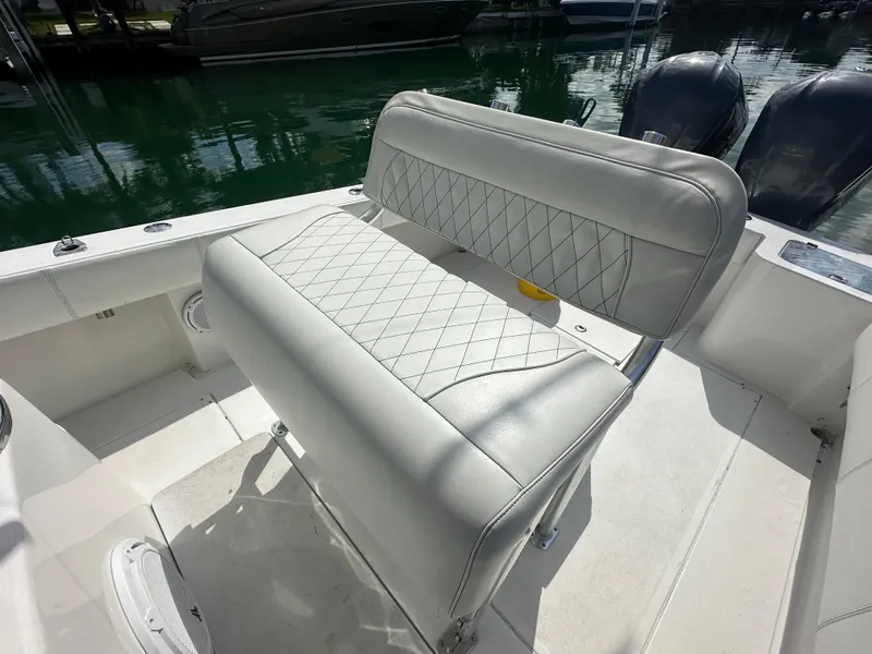 Slide: The Image of 1987 Whitewater 32 Open boat with cushioned seating and twin outboard motors. - 6
