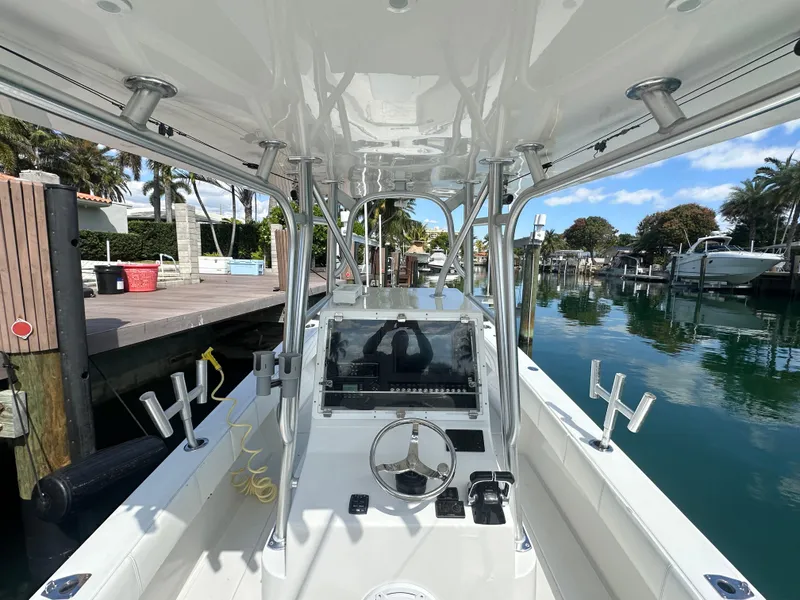 Slide: The Image of 1987 Whitewater 32 Open boat at dock, view of helm and controls. - 7