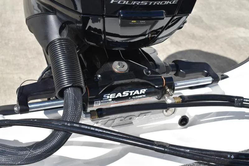 Slide: The Image of 2024 Triton 179 TrX boat engine with SeaStar hydraulic steering system. - 23