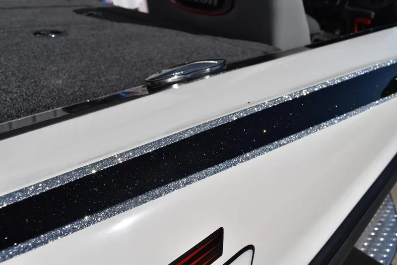 Slide: The Image of 2024 Triton 179 TrX boat with sleek, glittering trim detail. - 26