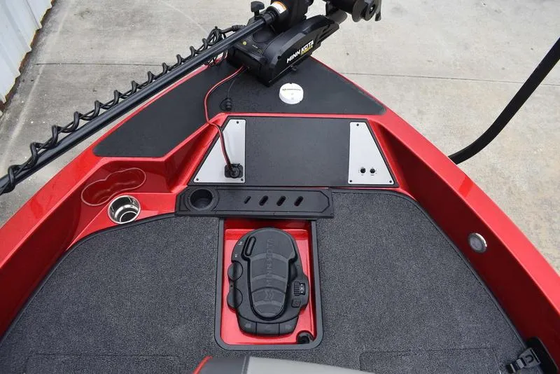 Slide: The Image of 2024 Triton 206 Allure boat deck with trolling motor and storage compartments. - 11