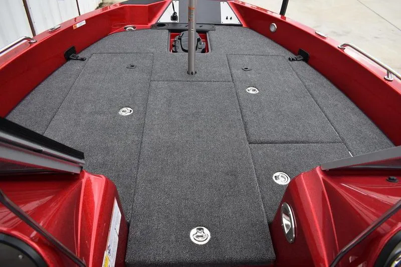 Slide: The Image of 2024 Triton 206 Allure boat interior with spacious deck and storage compartments. - 12