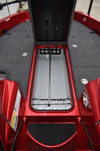 Slide: The Image of 2024 Triton 206 Allure boat interior with open storage compartment. - 14