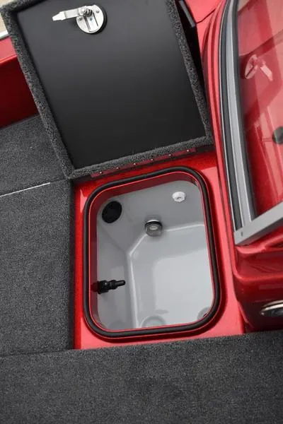 Slide: The Image of 2024 Triton 206 Allure boat storage compartment with lock and open hatch. - 16