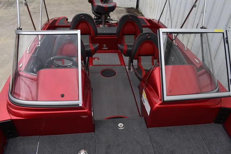 Slide: The Image of 2024 Triton 206 Allure boat interior with red and black seating and dual windshields. - 17