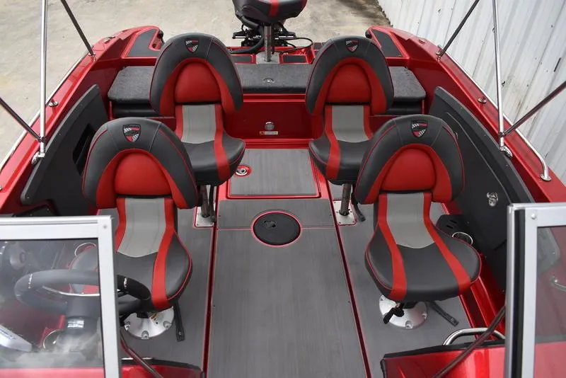 Slide: The Image of 2024 Triton 206 Allure boat interior with red and black seating. - 18