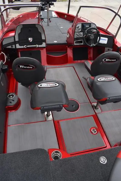Slide: The Image of 2024 Triton 206 Allure boat interior with seating and dashboard. - 19
