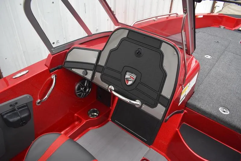 Slide: The Image of 2024 Triton 206 Allure boat interior, red and black dashboard, steering console. - 24