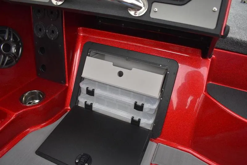 Slide: The Image of 2024 Triton 206 Allure boat storage compartment with tackle boxes. - 26