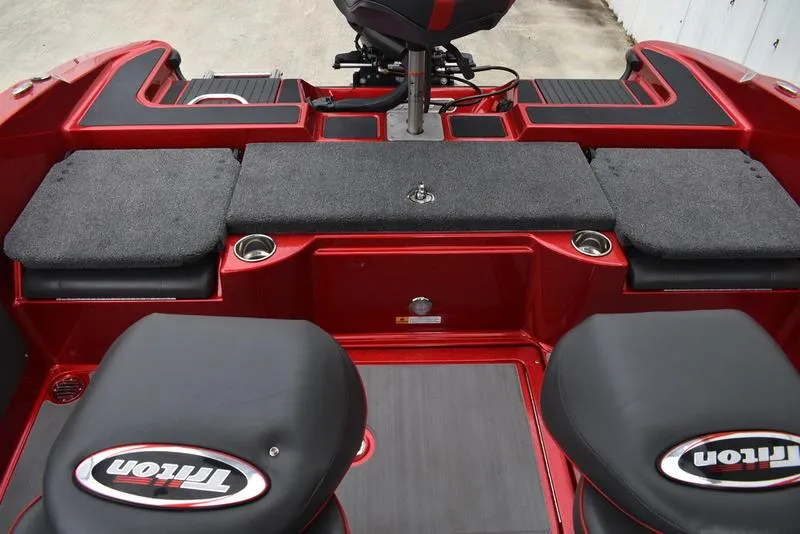 Slide: The Image of 2024 Triton 206 Allure boat interior with seating and storage compartments. - 30