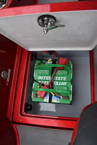 Slide: The Image of Battery compartment of 2024 Triton 206 Allure boat with Interstate battery. - 35