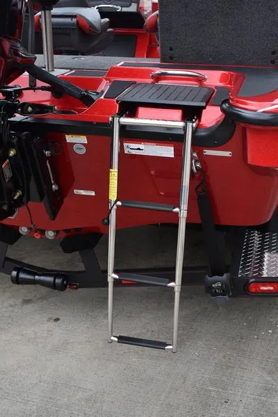 Slide: The Image of 2024 Triton 206 Allure boat with a foldable boarding ladder. - 36