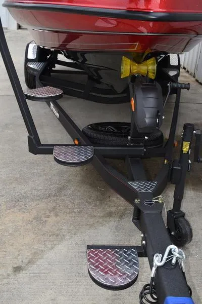 Slide: The Image of 2024 Triton 206 Allure boat trailer with diamond plate steps. - 37