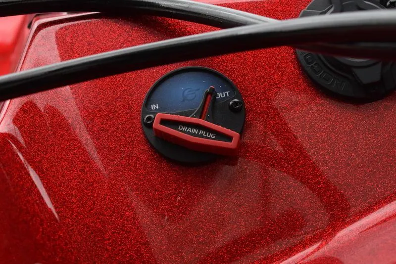 Slide: The Image of Close-up of 2024 Triton 206 Allure drain plug on red metallic surface. - 40