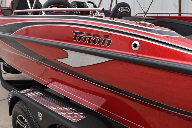 Slide: The Image of 2024 Triton 206 Allure boat, red exterior with sleek design. - 6