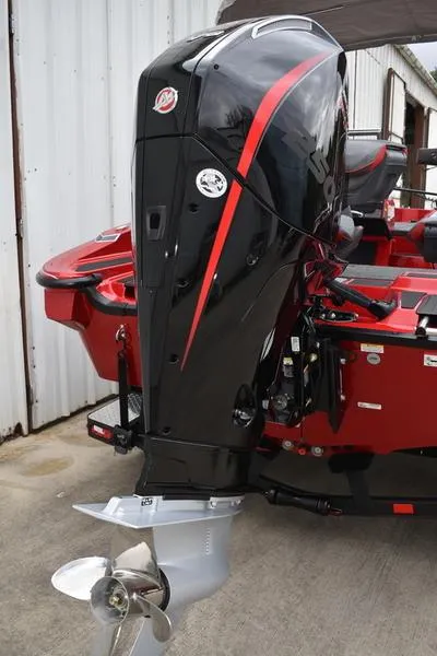 Slide: The Image of 2024 Triton 206 Allure boat with powerful outboard motor. - 7