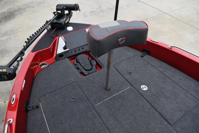 Slide: The Image of 2024 Triton 206 Allure boat interior with red accents and fishing seat. - 9