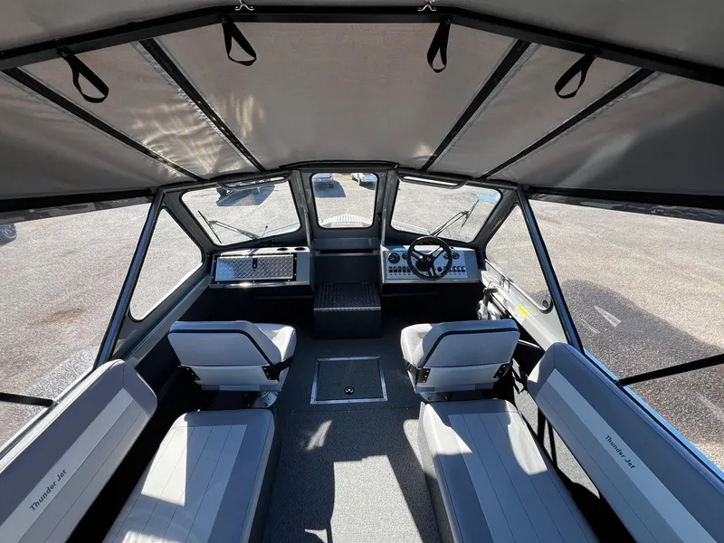 Slide: The Image of Interior of 2024 Thunder Jet 210 Luxor boat with seating and steering console. - 11
