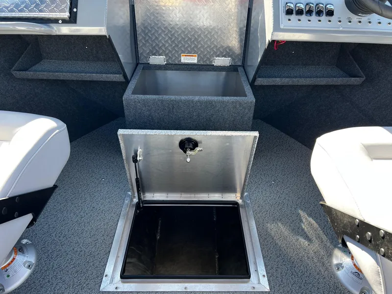 Slide: The Image of 2024 Thunder Jet 210 Luxor boat interior with open storage compartment. - 15