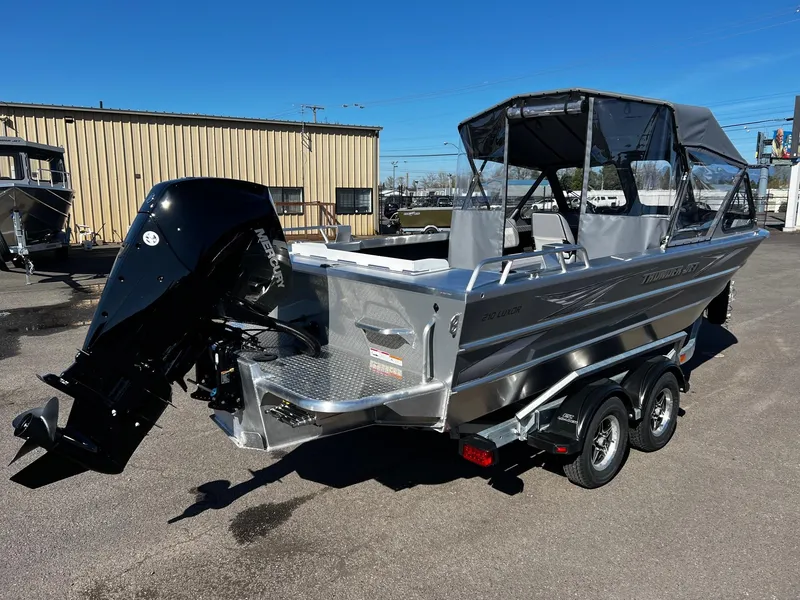 Slide: The Image of 2024 Thunder Jet 210 Luxor boat with outboard motor and trailer. - 2
