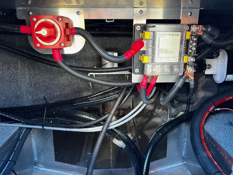 Slide: The Image of Electrical wiring and components inside a 2024 Thunder Jet 210 Luxor boat. - 21